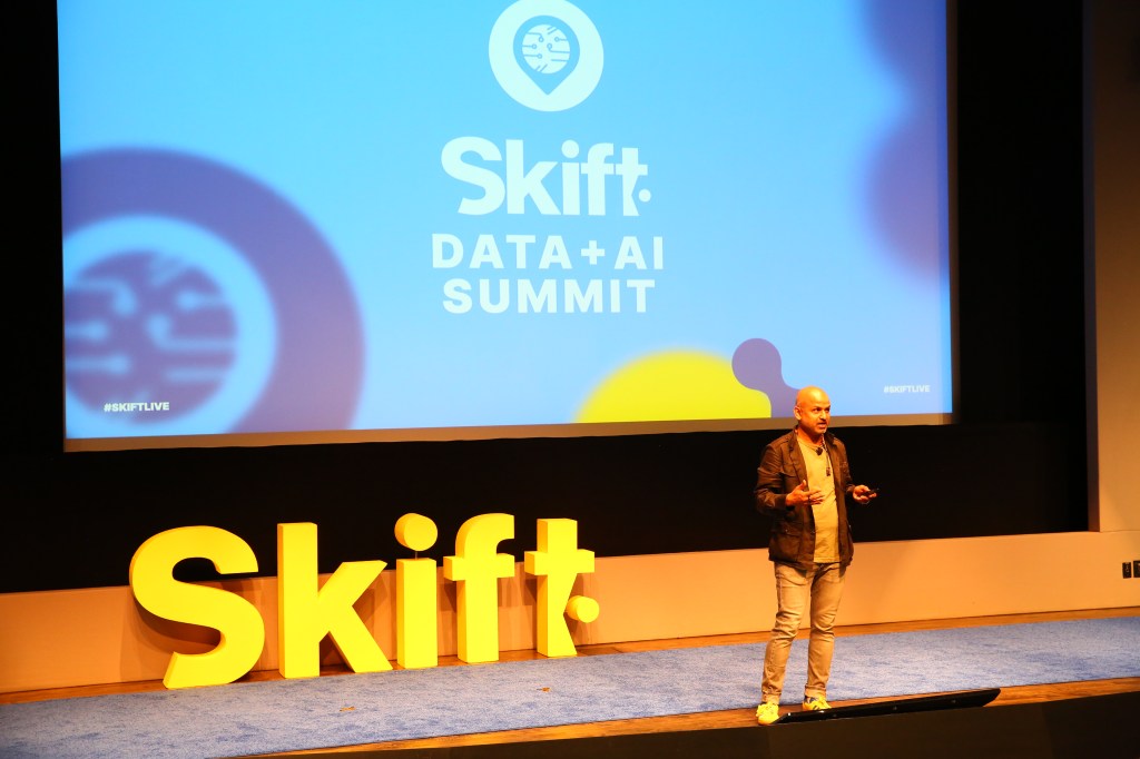 Skift Founder and CEO Rafat Ali on stage at Skift Data + AI Summit