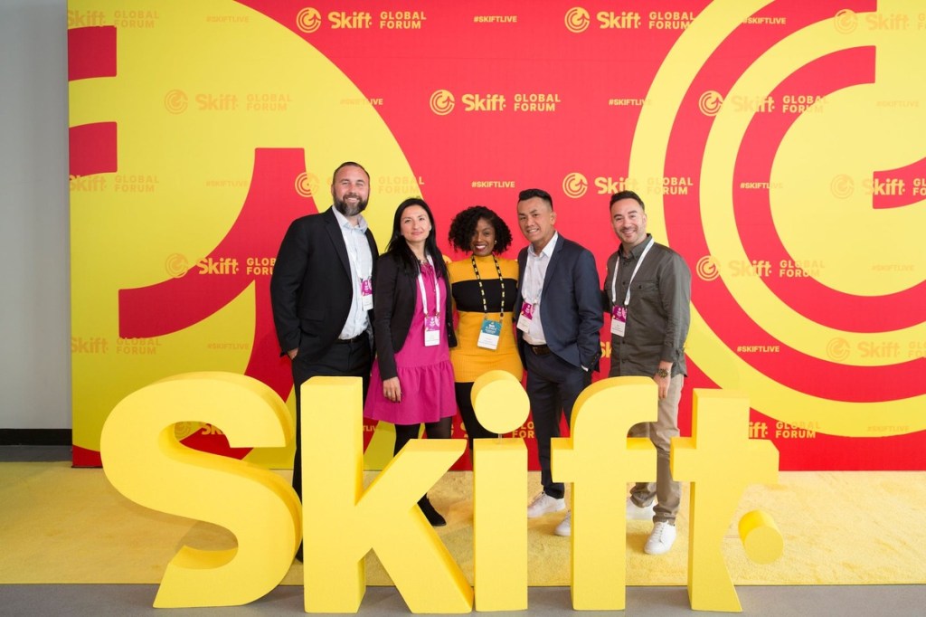 attendees and the skift signage