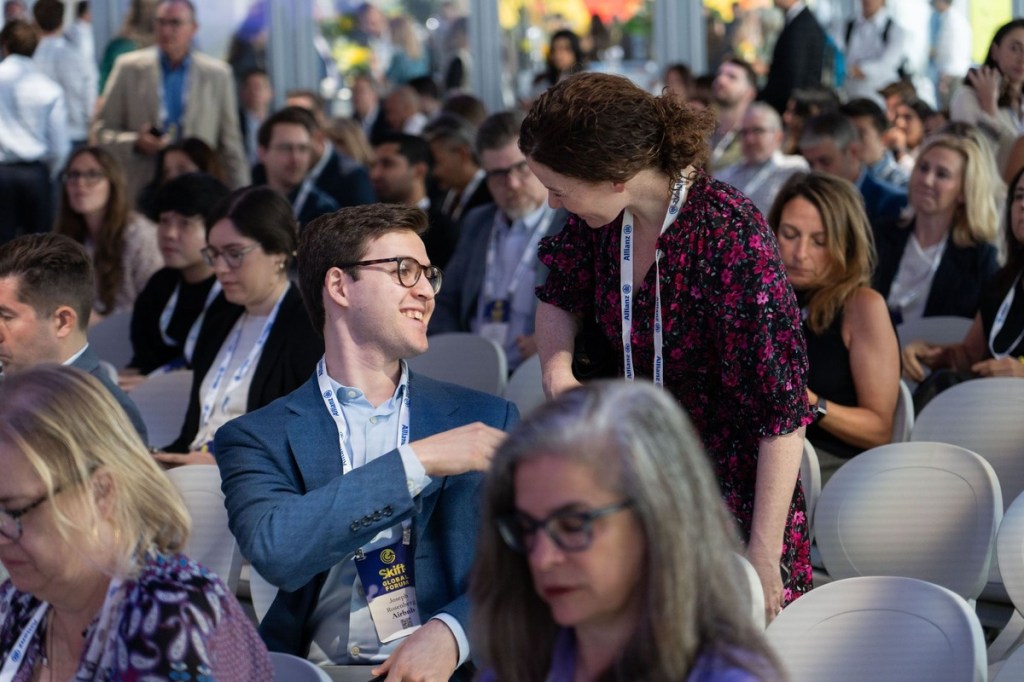 skift global forum attendees having a conversation